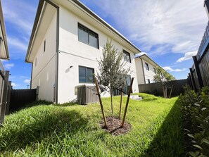A modern two-story building with a flat roof and large windows. - 302 Rare find The Blue Sky Beach House (Florida City)
