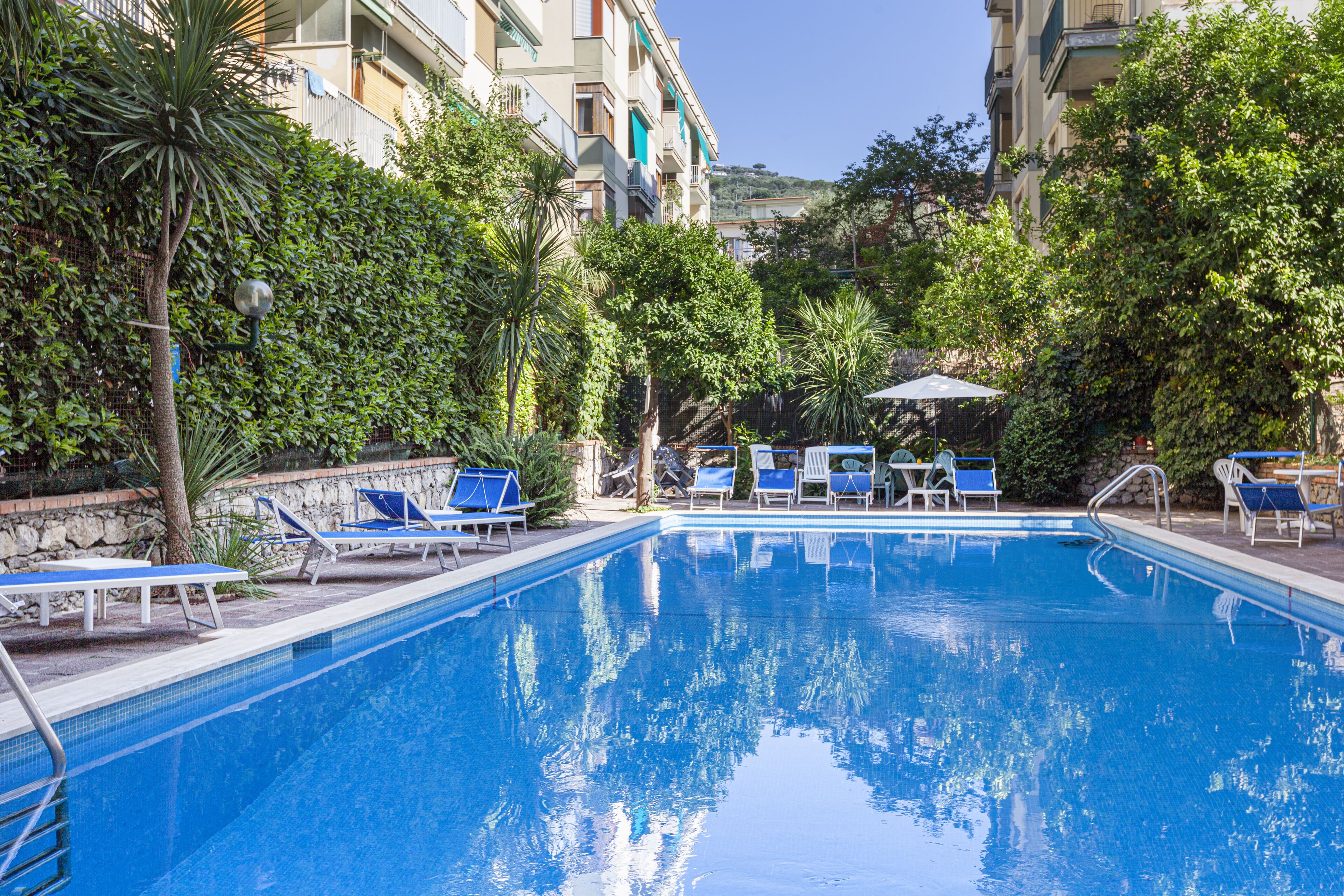 Seasonal outdoor pool, open 10:00 AM to 6:00 PM, pool loungers