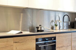 Apartment (1 Bedroom) | Private kitchen | Fridge, microwave, oven, stovetop