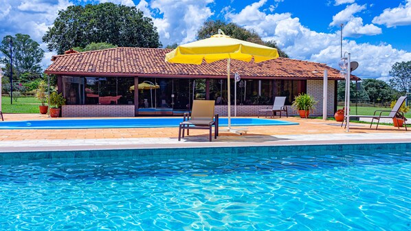 2 outdoor pools, open 9:00 AM to 10:00 PM, pool loungers