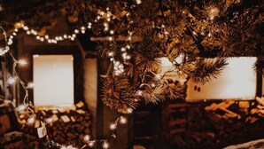 A cozy room with a bed, a window, and a fireplace. - Big Sky Bungalow - Center of Big Sky (Big Sky)
