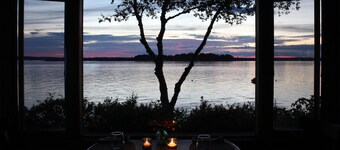 Quaint cottage intimately set on the rocky coast overlooking Casco Bay