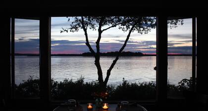 Quaint cottage intimately set on the rocky coast overlooking Casco Bay