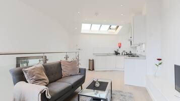 Luxury Apartment | Living area | 32-inch flat-screen TV with digital channels, TV