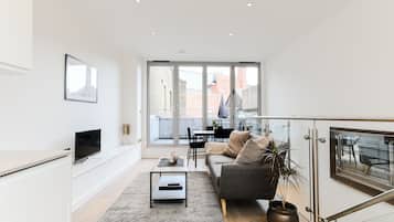 Luxury Apartment | Living area | 32-inch flat-screen TV with digital channels, TV