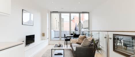 Luxury Apartment | Living area | 32-inch flat-screen TV with digital channels, TV