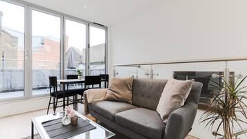 Luxury Apartment | Living area | 32-inch flat-screen TV with digital channels, TV