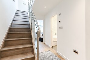 Luxury Apartment | Living area | 32-inch flat-screen TV with digital channels, TV