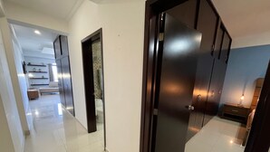 A modern interior with a hallway leading to a bedroom. - Marina del Rey (Mazatlán)