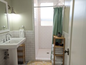 Shower, hair dryer, towels, soap