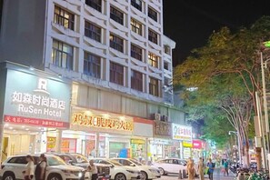A hotel with multiple floors and a prominent sign for the RuSen Hotel.