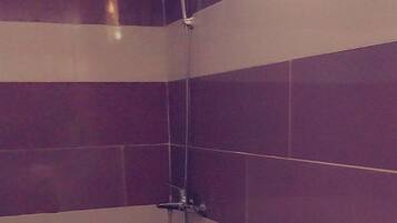 Deluxe Tent | Bathroom | Separate tub and shower, rainfall showerhead, bidet, towels