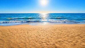 A beach with sand, waves, and a clear sky. - Libby`s Cove - Swim spa open all year! kayaks&more (Port Sanilac)