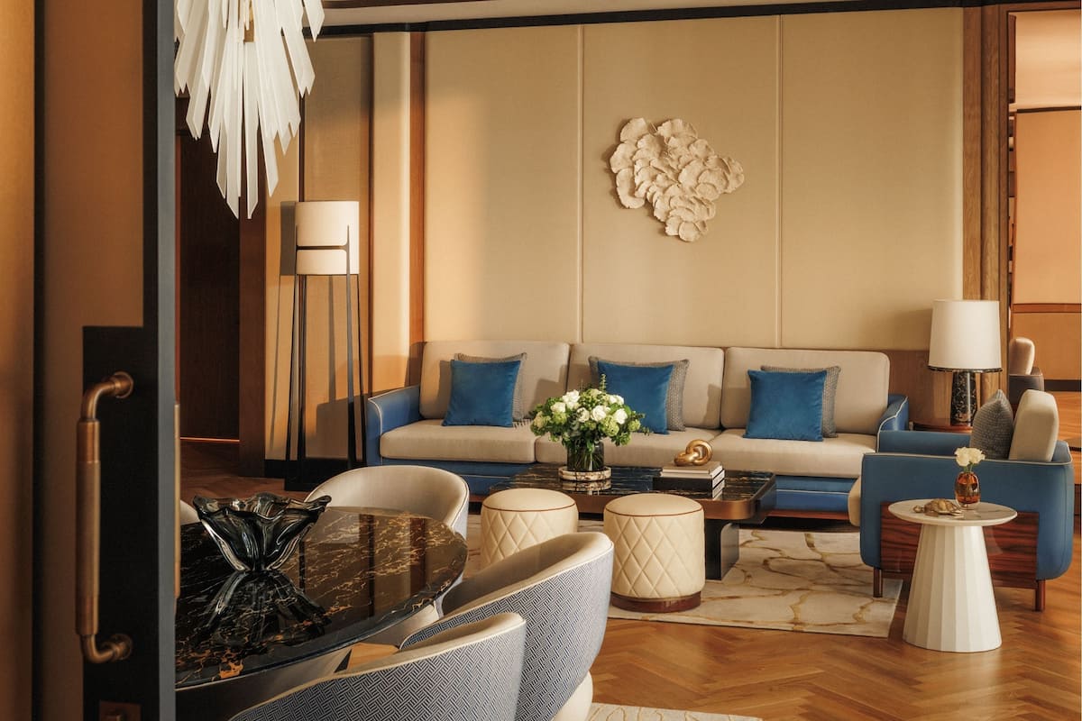 A modern living room with a sofa set, a coffee table, and a side table.