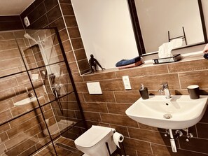 Shower, hair dryer, towels, soap
