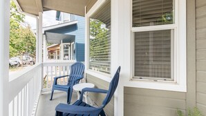 A porch with two blue Adirondack chairs and a small table. - //The Tag House// 5 minutes to BSU, airport, hiking and downtown (Boise)