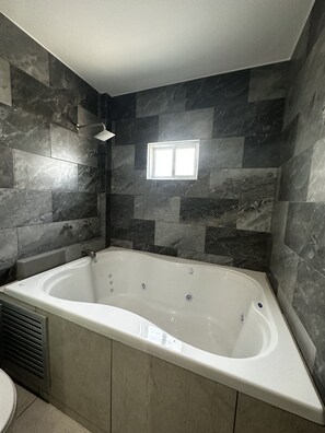 Habitación Deluxe | Tina de hidromasaje privada