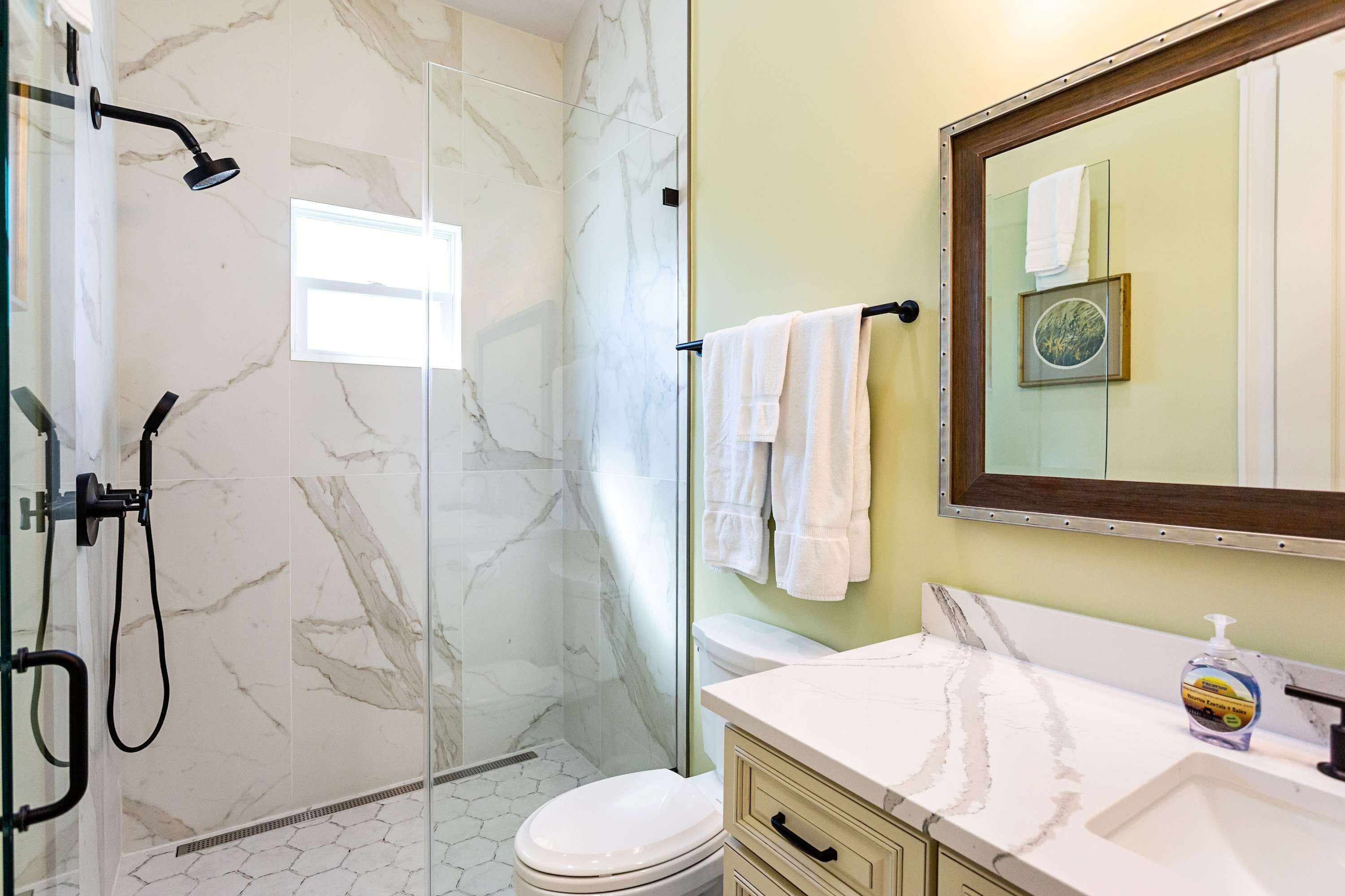 Suite #2 bathroom with zero threshold walk-in shower.