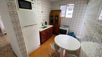 Classic Apartment, 1 Bedroom | Private kitchen | Full-sized fridge, microwave, stovetop, coffee/tea maker