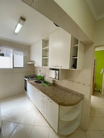 Classic Apartment | Private kitchen | Full-size fridge, microwave, stovetop, coffee/tea maker