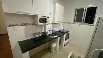 Apartment | Private kitchen | Full-sized fridge, microwave, stovetop, coffee/tea maker