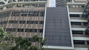A high-rise building with multiple balconies and a sign reading "THE RADISANCE MANILA". - Pet Friendly Staycation at The Radiance Manila Bay (Pasay)