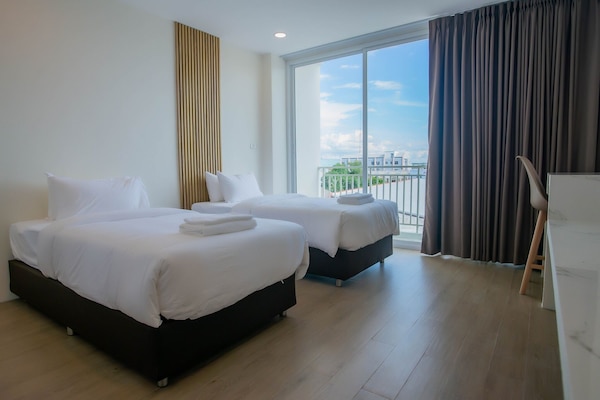 Premium bedding, blackout curtains, soundproofing, free WiFi