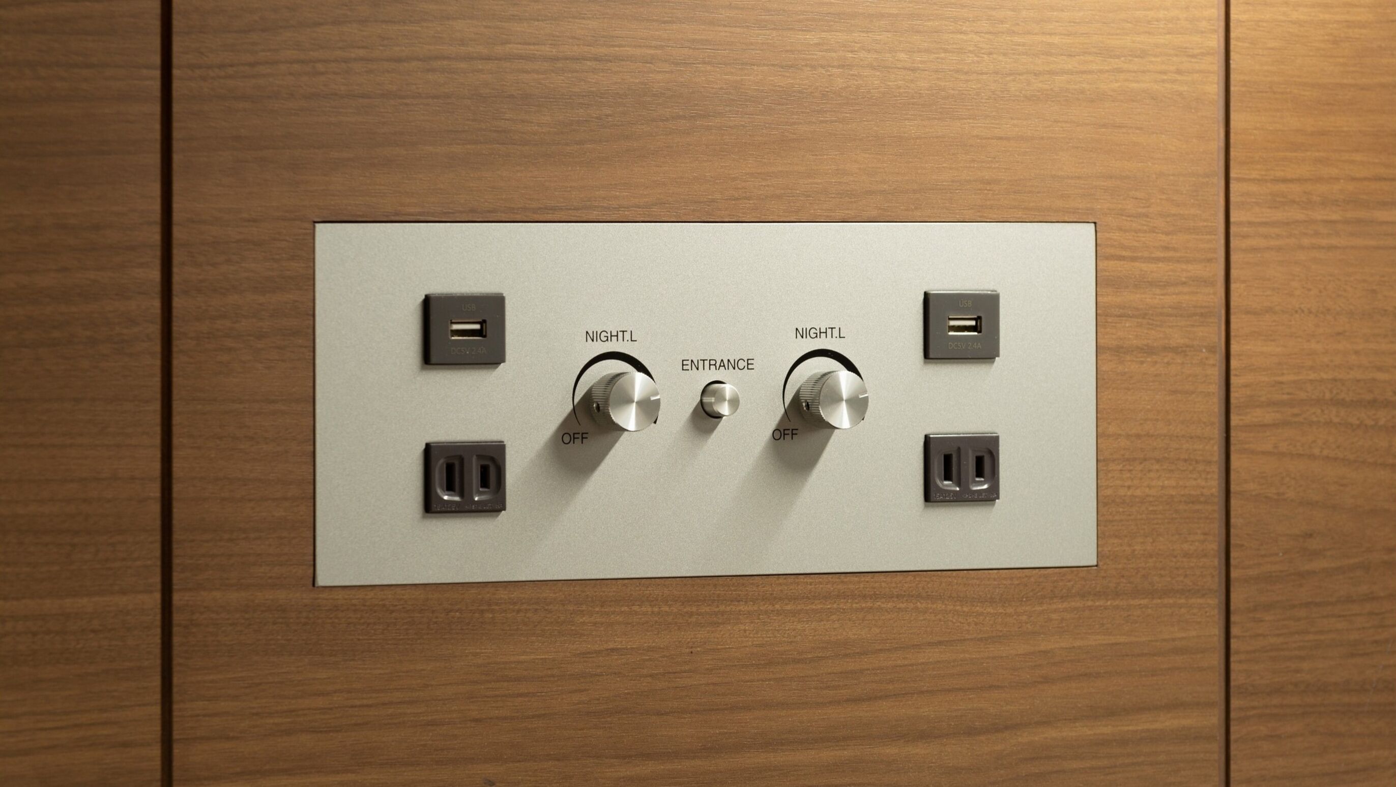 A control panel with two USB ports, two power outlets, and two dimmer switches labeled "NIGHT.L" and "ENTRANCE."