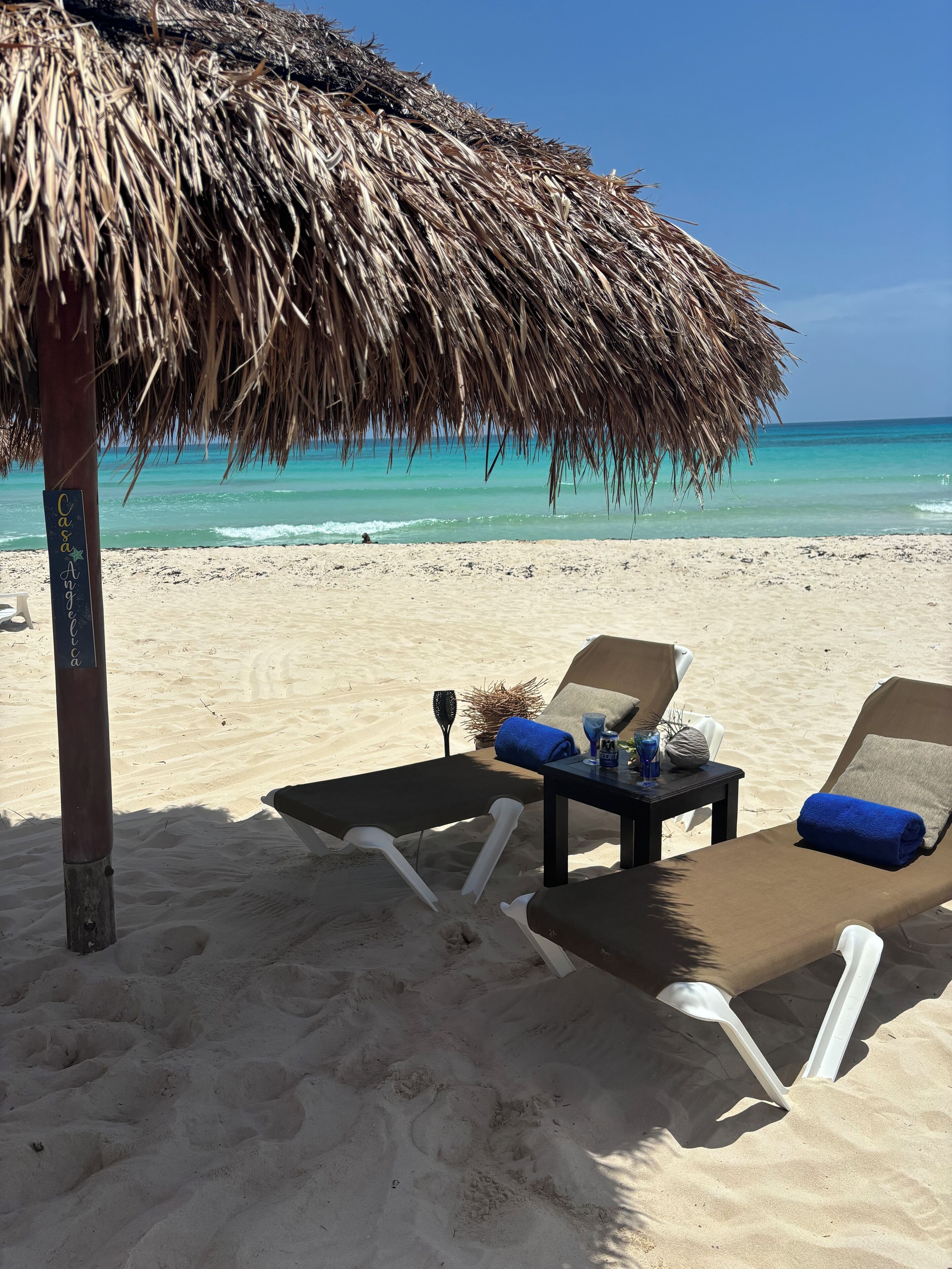 On the beach, sun loungers, beach towels