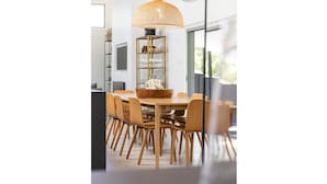 A modern dining area with a round wooden table, six wooden chairs, and a large woven pendant light. - Stunning, Sleek and Refined, The Black Beach House is perfection from the time you walk through the (Elizabeth Beach)