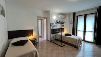 Basic Quadruple Room | Pillowtop beds, desk, free WiFi, bed sheets