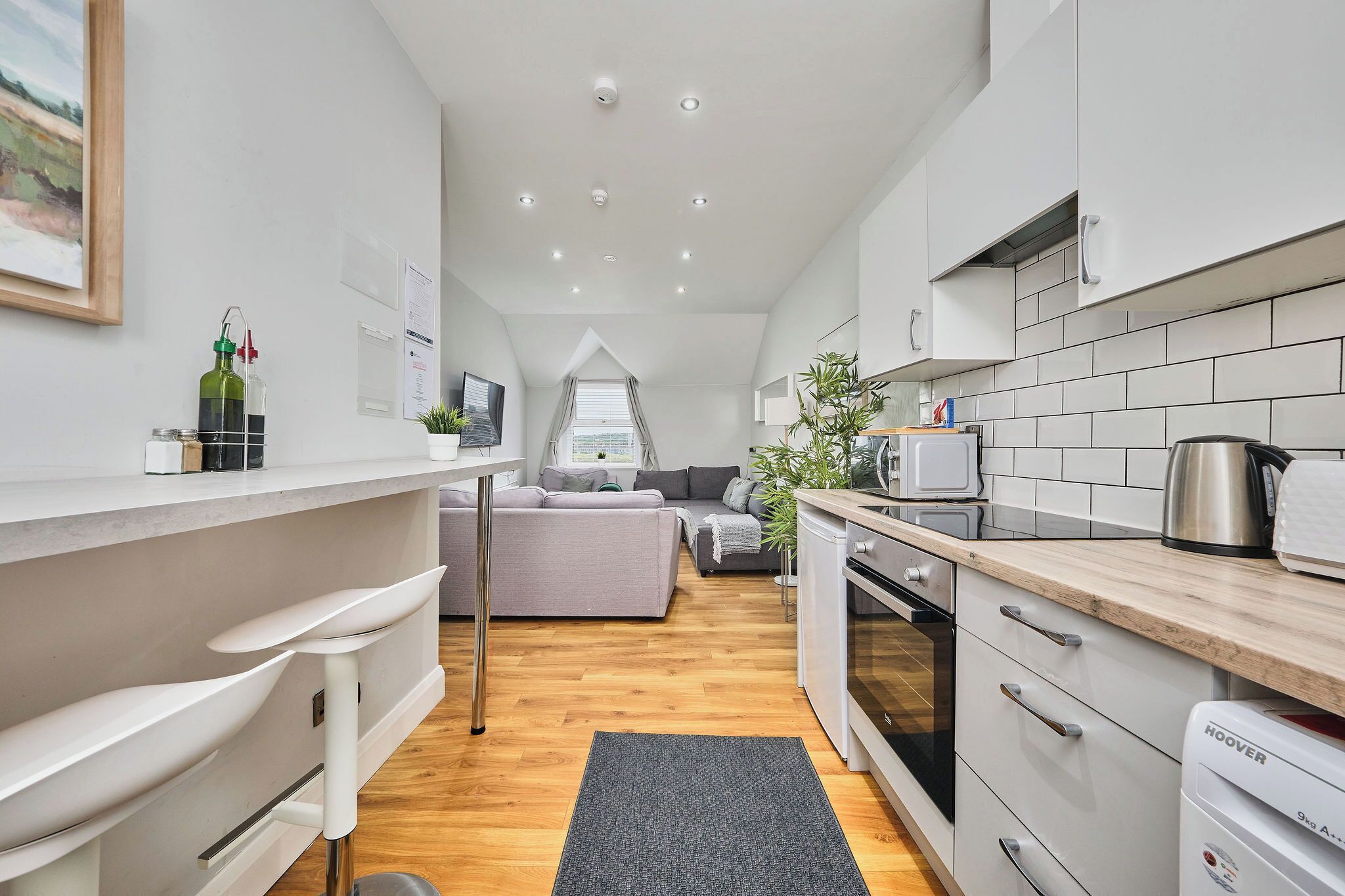 Exclusive Apartment, Multiple Beds | Living area | 40-inch TV with digital channels