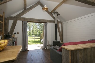 Idyllic Log Cabin with Log-fired Hot Tub nestled in a Forest Clearing