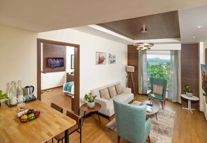 Diplomatic Suite | Living area | 50-inch Smart TV with satellite channels, TV, computer monitors - Distrikt 9 (Palakkad)