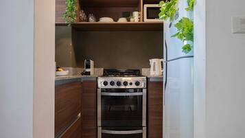 Microwave, coffee/tea maker, toaster, cookware/dishes/utensils