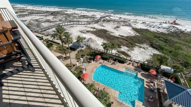 A pool area with a view of the beach and ocean. - Beach Baby 808/ Beachfront Beauty/ The Beach Club (Gulf Shores)