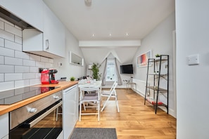 Comfort Apartment | Living area | 40-inch TV with digital channels