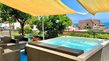 Seasonal outdoor pool, open 10:00 AM to midnight, pool umbrellas