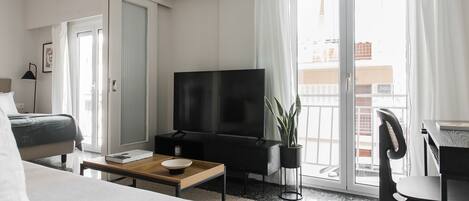 Standard Apartment | Living area | 43-inch Smart TV with digital channels, TV, Netflix