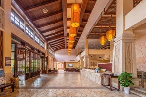 A spacious lobby with high ceilings, a reception desk, and a large seating area. - Chaohu Fragrant Hotspring Spa Resort (He County)