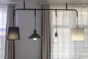 A ceiling-mounted lighting fixture with three different styles of lamps. - Chaoqibanpo (Zhoushan)