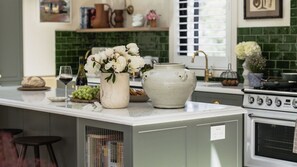 Fridge, dishwasher, coffee/tea maker, cookware/dishes/utensils