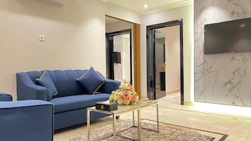 Deluxe Apartment | Living area | 5-inch Smart TV with satellite channels, TV