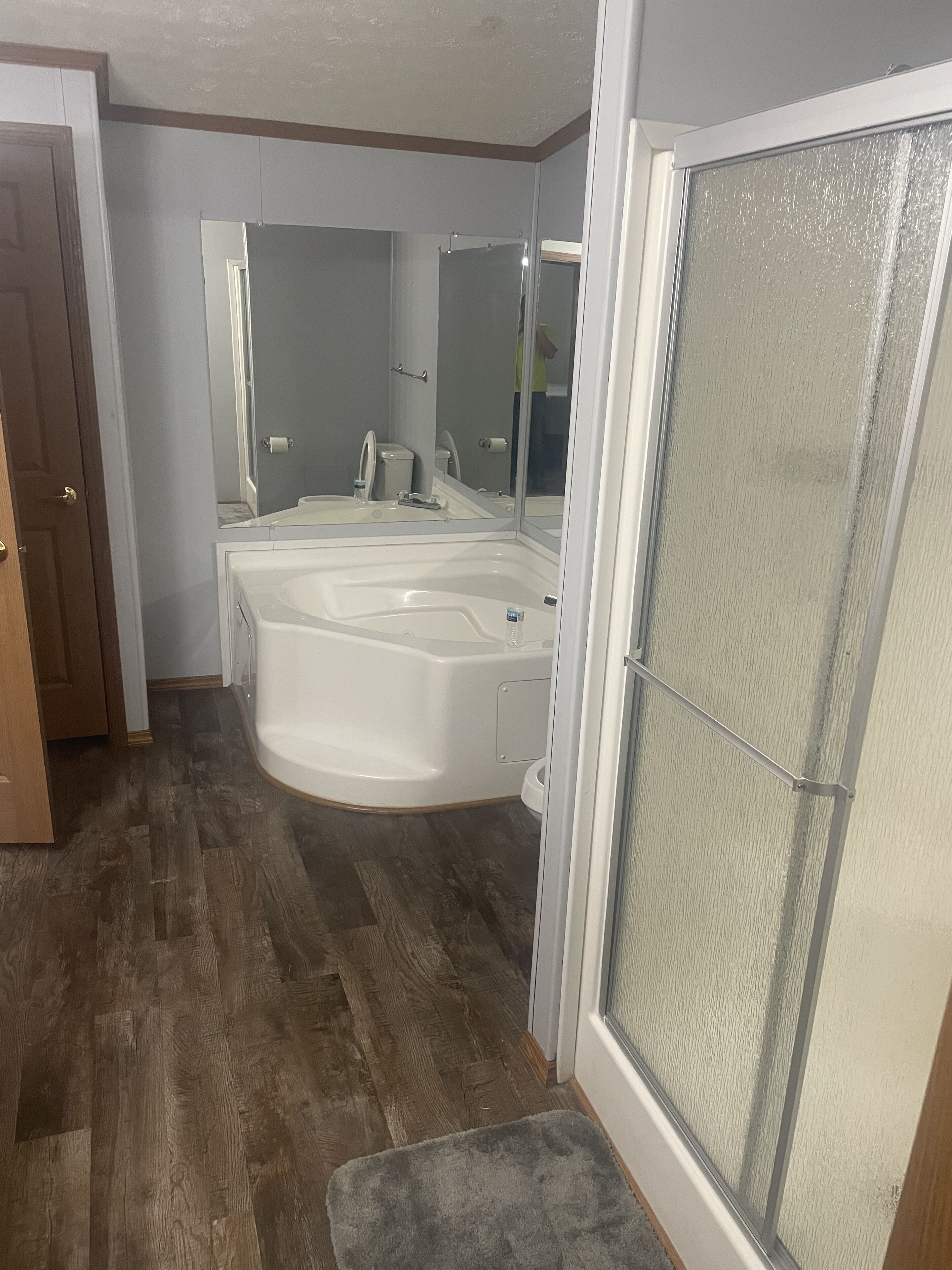 A bathroom with a bathtub, a shower, and a toilet.
