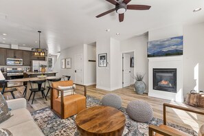 Smart TV, fireplace, books, offices