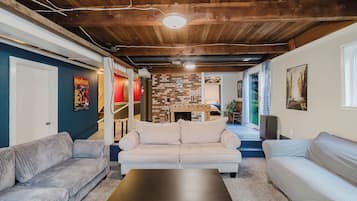 Smart TV, fireplace, foosball, books