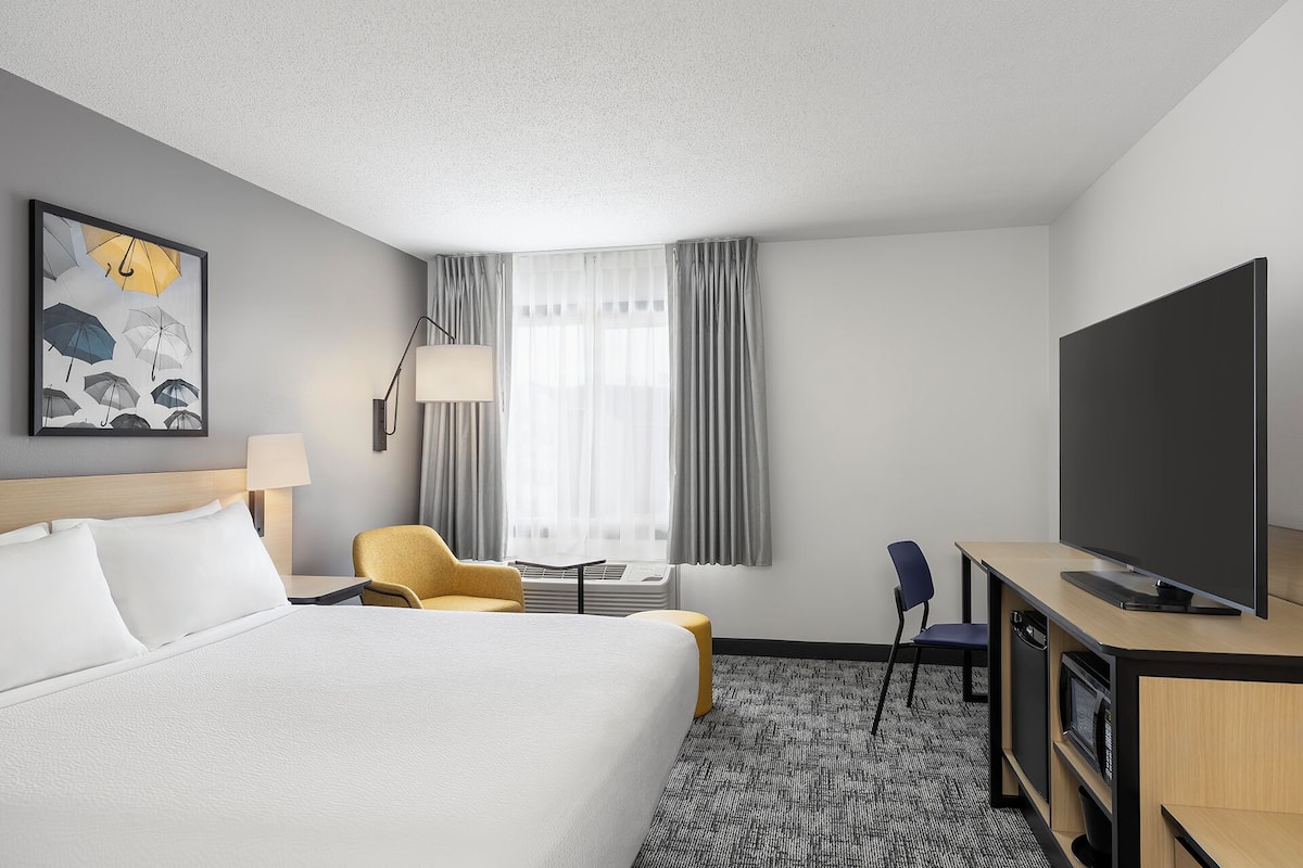 Desk, laptop workspace, blackout curtains, iron/ironing board