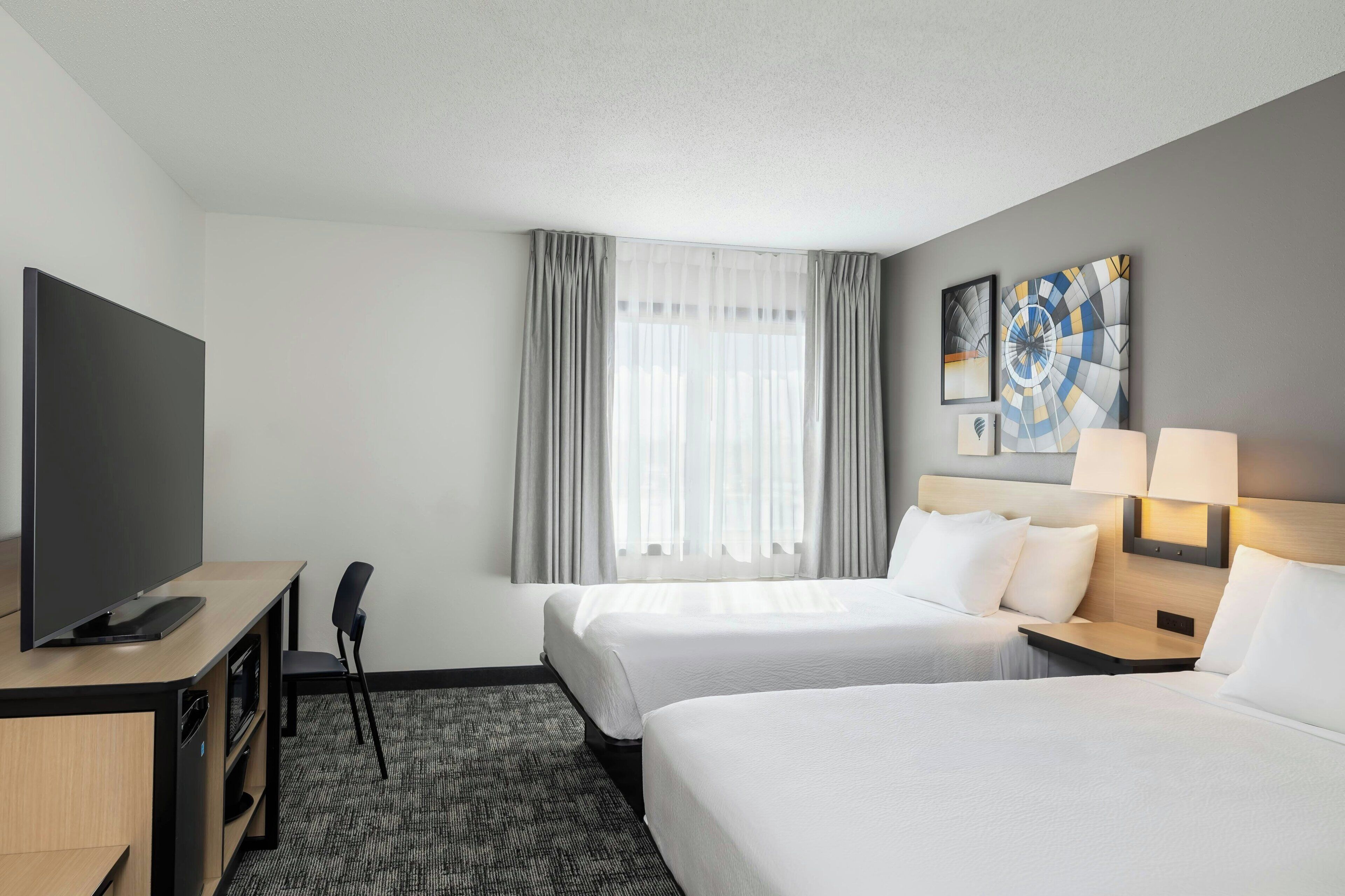 Desk, laptop workspace, blackout curtains, iron/ironing board