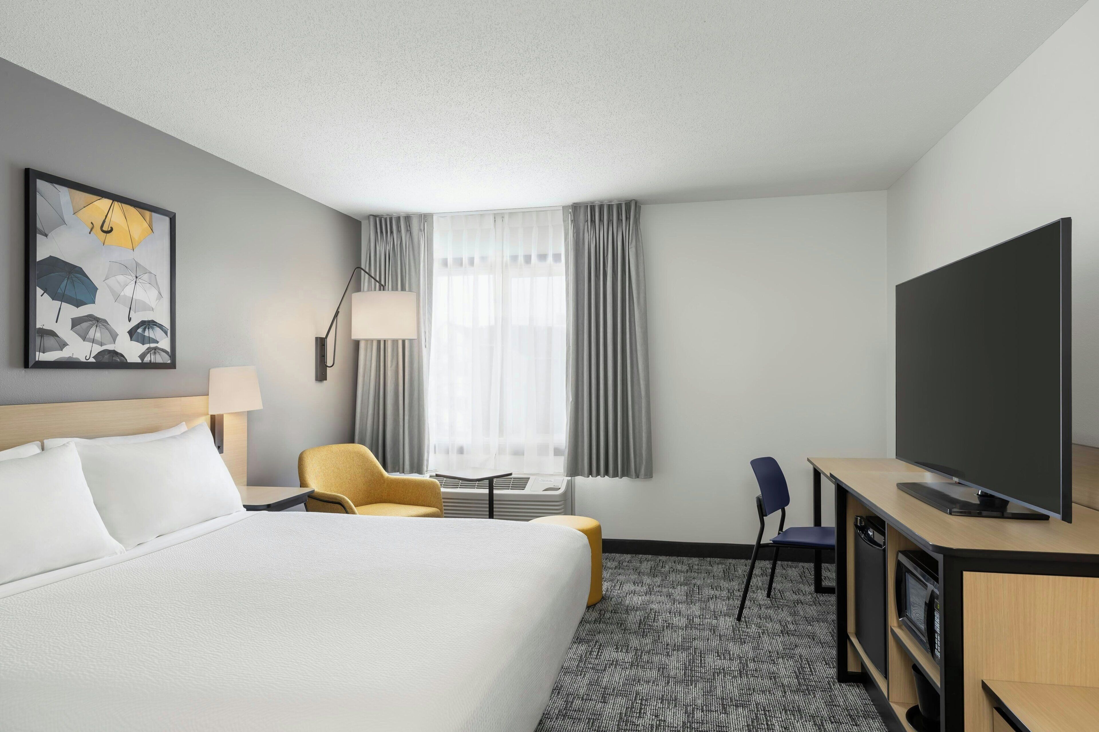 Desk, laptop workspace, blackout curtains, iron/ironing board