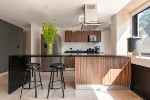 Fridge, microwave, stovetop, coffee/tea maker